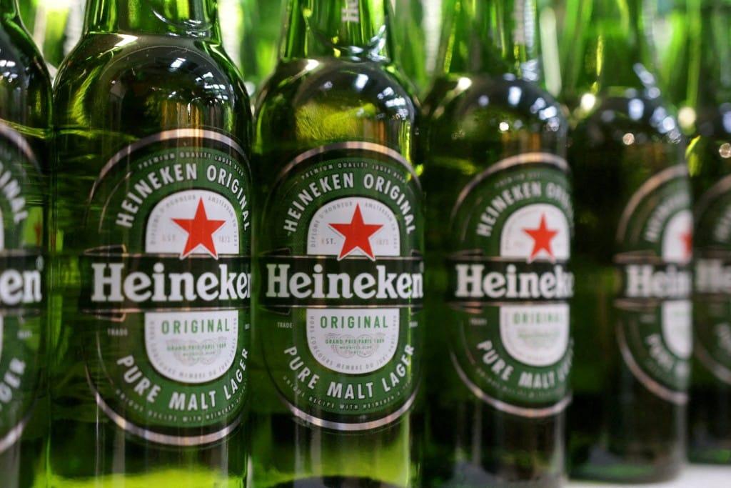Heineken Announces Up to 6,000 Job Cuts as Beer Sales Slide Bottles of Heineken beer are displayed in a supermarket. | REUTERS/Dado Ruvic.