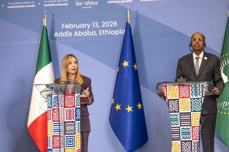 AU Chairperson Condemns Gaza "Extermination" Chairperson of the African Union Commission Mahmoud Ali Youssouf (right) listens as Italian Prime Minister Giorgia Meloni (left) speaks during the closing news conference of the Second Italy-Africa Summit at the Addis International Convention Center (AICC) in Addis Ababa, February 13, 2026 | Marco Simoncelli/AFP