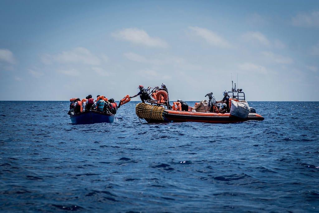 Two Survivors After Migrant Boat Sinks Off Libya, 53 Feared Dead The photo shows migrants and refugees being rescued in the Mediterranean | Flavio Gasperini/UN