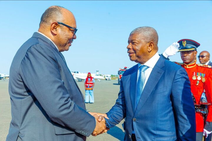 Tanzania's Minister for Foreign Affairs and East African Cooperation, Mahmoud Thabit Kombo (L) welcomes Angola's President João Lourenço in Tanzania who is expected to undertake two-day visit in the country